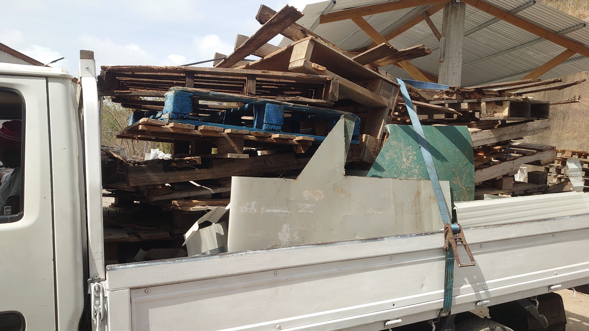10 Points Movers hauling pallets and materials in Grenada